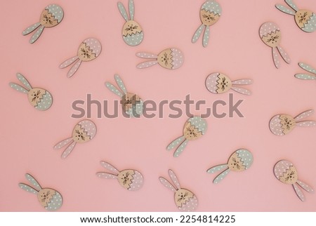 Trendy Easter pattern made with pink and pastel blue rabbits on bright pink background. Minimal Easter concept.