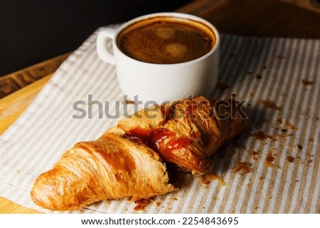 strawberry jam croissant and coffee