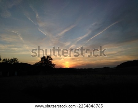 Beautiful evening mood in a landscape at sunset and cloud images