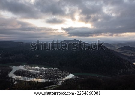 Bieszczady. Cloudy sunrise in the mountains. Moody morning in the mountains. Sun through the clouds in the mountains. Sunrays in mountains.