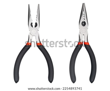 Needle nose pliers. Wire cutter or flush nippers. Universal long nose pliers for electric wire. Professional tools for metal construction. Mechanic instrument for workshop, repairing works.  Royalty-Free Stock Photo #2254893741