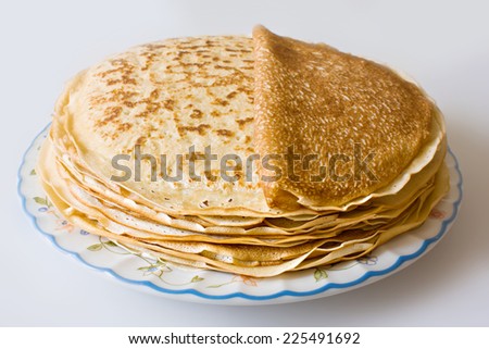 a pile of freshly cooked pancakes on a plate