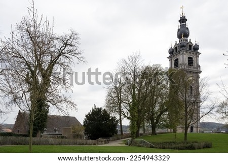 Architectural detail of the Belfry of Mons, the only belfry in Belgium constructed in Baroque style (inscribed on the UNESCO World Heritage on 1999), part of the major cultural patrimony of Wallonia Royalty-Free Stock Photo #2254943329