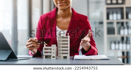 Real estate broker agent working and consult online to decision making sign a contract, Attractive young business woman african american lawyer at desk