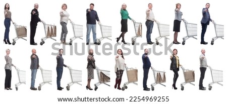 a group of people with a shopping cart point their finger at the camera