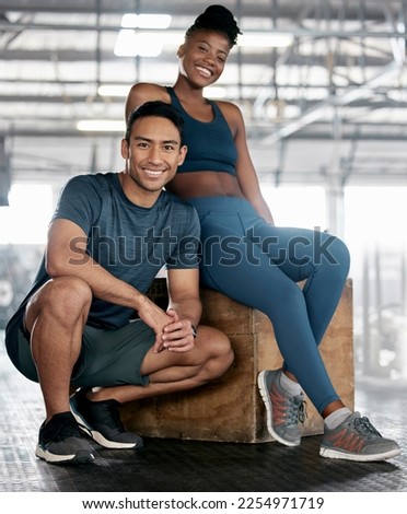 Fitness, portrait or personal trainer with a happy client at gym for training, exercise or body workout. Team partnership, Indian coach or black woman smiles with pride together in a health club Royalty-Free Stock Photo #2254971719