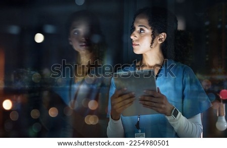Medical, thinking and night with doctor and tablet for planning, medicine and schedule. Technology, review and digital with black woman reading report for healthcare, science and life insurance news Royalty-Free Stock Photo #2254980501