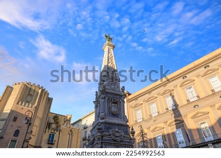 View of the Piazza San Domenico Maggiore, one of the most important squares in the historical center of Naples. It is dominated by the imposing marble obelisk of the San Domenico Maggiore. Royalty-Free Stock Photo #2254992563