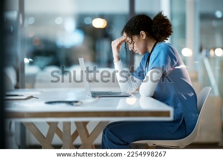 Nurse, headache stress and black woman in hospital feeling pain, tired or sick on night shift. Healthcare, wellness or female medical physician with depression or burnout while working late on laptop Royalty-Free Stock Photo #2254998267