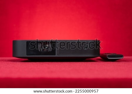 projector on a red background