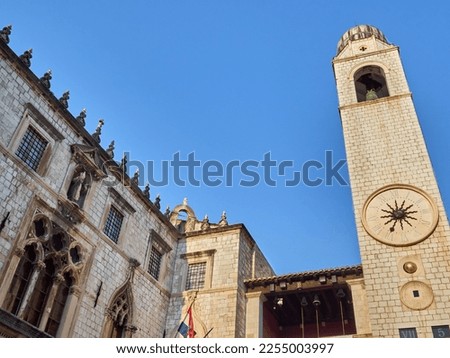 City Bell Tower and Sponza Palace, located at the end of Stradun, in Luža Square. Dubrovnik Old Town, Croatia, Europe. Photo with copy space