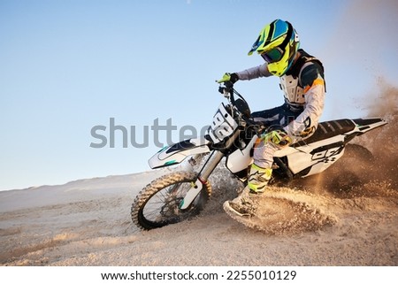 Desert, moto cross or sports adventure athlete in sand for exercise, workout or speed. Travel, dirt and bike with energy of man in Dubai race on dirt with challenge and sport fitness with freedom