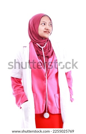 Confident female nurse. Confident Muslim female doctor standing over isolated white background. Closeup portrait of friendly, smiling confident Muslim female doctor.