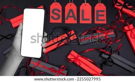 St Valentine's day sale! Creative trend abstract template collage of man's hand arm algorithm receives gift boxes mobile phone isolated over black background.