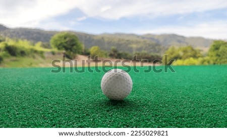 Golf ball while on the driving range at paradise golf