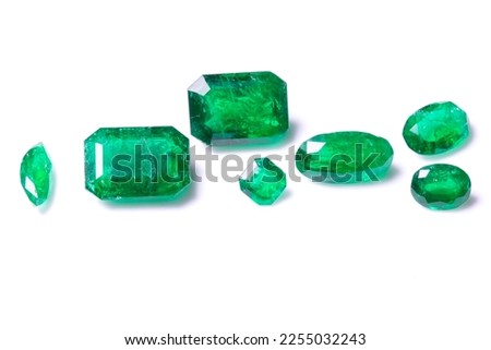 A collection of loose Emerald gemstones. Single stones for jewellery. Isolated on a white background Royalty-Free Stock Photo #2255032243