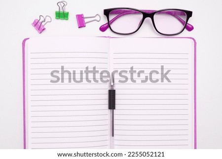 Office Supplies Over Desk With Keyboard And Glasses And Coffee Cup For Working Remotely, Assorted School Utilities For Studying With Eyeglasses.