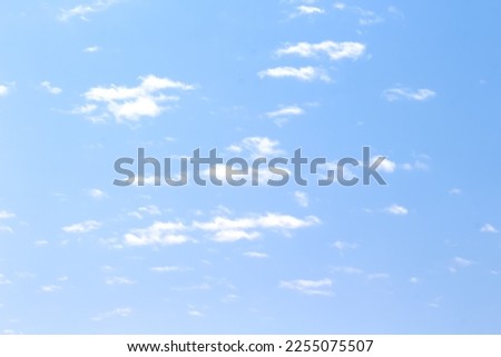 Light clouds blue sky background and breeze