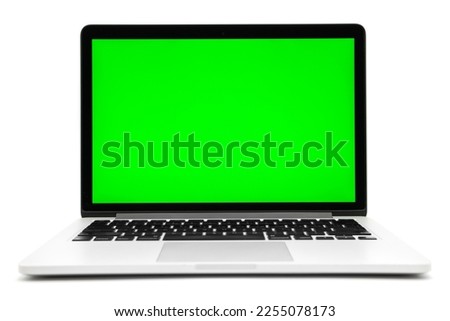 Laptop computer with green screen isolated on white background.