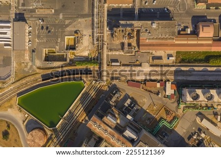 Drone photography of big chemical factory, pipes and railway during summer day