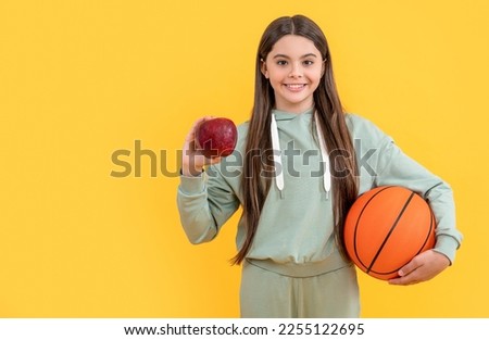 teen basketball girl isolated on yellow. teen basketball girl in studio. teen basketball girl