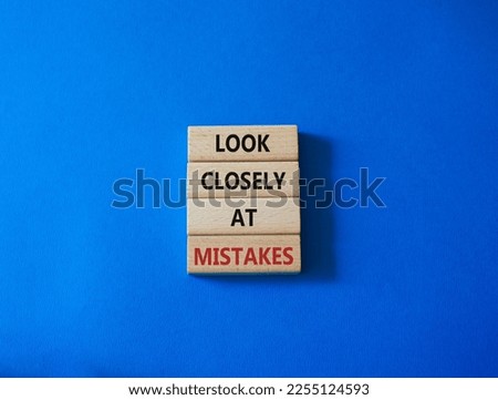 Look closely at mistakes symbol. Wooden blocks with words Look closely at mistakes. Beautiful blue background. Business and Look closely at mistakes concept. Copy space.