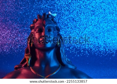 Maha Shivratri, Lord Shiva on blue background. Royalty-Free Stock Photo #2255133857