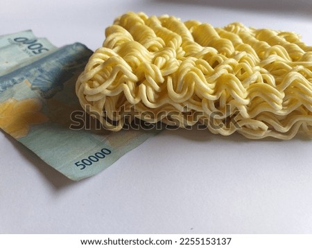 texture of dry noodles with Indonesian rupiah currency in fifty thousand denominations