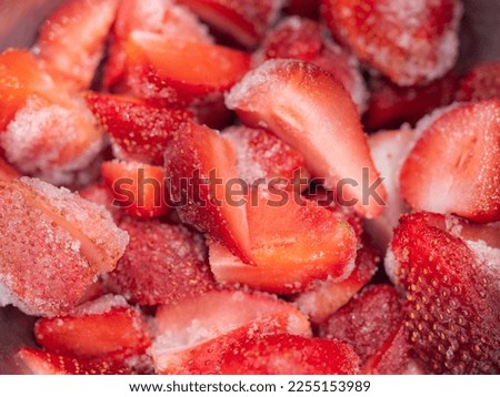 chunks of frozen strawberries for sweet making and cocktails Royalty-Free Stock Photo #2255153989