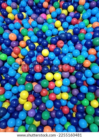 colorful ball pool.  all colors in polka dots.  Rainbow Royalty-Free Stock Photo #2255160481