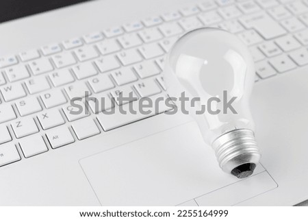Laptop and light bulb. Image of business idea