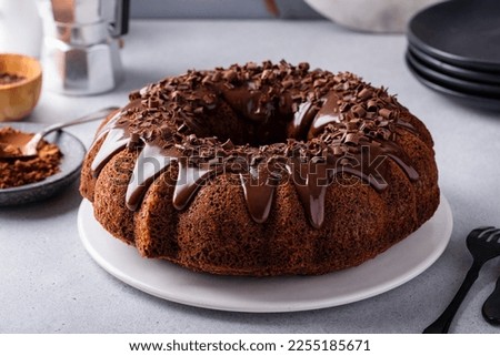 Chocolate bundt cake drizzled with chocolate ganache glaze