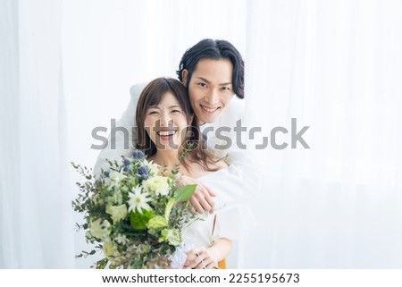 Asian couple getting married. Bridal photo. Photo wedding. Photo studio. Royalty-Free Stock Photo #2255195673