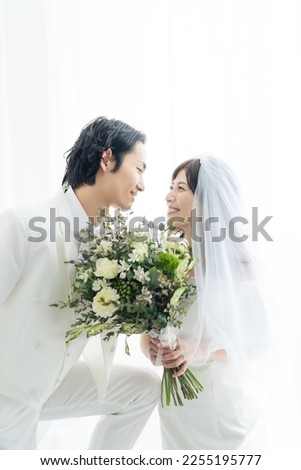 Asian couple getting married. Bridal photo. Photo wedding. Photo studio.
