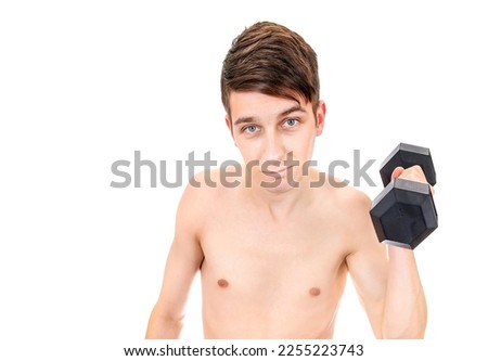 Skinny Young Man in hold a Heavy Dumbbell Isolated on the White Background closeup Royalty-Free Stock Photo #2255223743