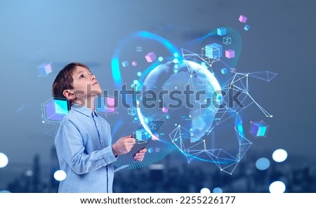 Child boy with tablet in hands looking up at earth sphere hud, web lines hologram and floating colorful big data cubes. Concept of metaverse and education