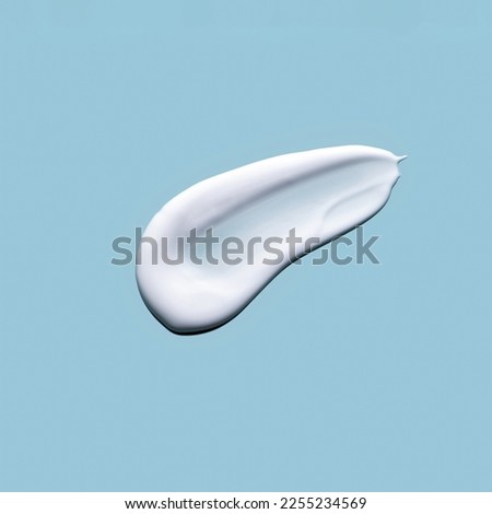 Skin care cream, face serum swatch smear on blue background. Skincare product creamy texture smudge swipe closeup. 
 Royalty-Free Stock Photo #2255234569