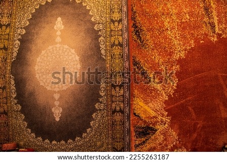 Carpets wall mat with a pattern on a background of orange and red