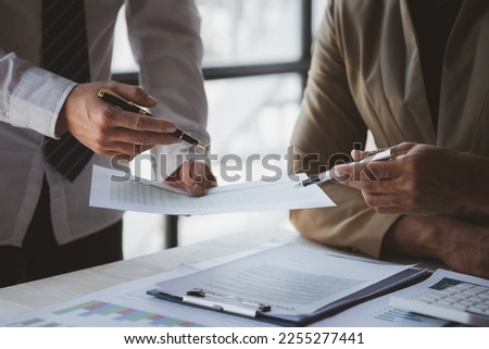 Atmosphere of a startup company meeting, business people are meeting together to summarize and plan investment finances, they are the founders of the company. Business administration concept. Royalty-Free Stock Photo #2255277441