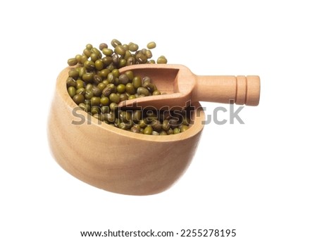Green mung beans fly throw up in wooden bowl, green mung bean float explode, abstract cloud fly. Dried green mung beans splash throwing in Air. White background Isolated high speed shutter, freeze