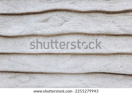 Background, texture of a wall, a fence made of gray concrete, stone. Close-up photography, abstraction, copy space, surface.