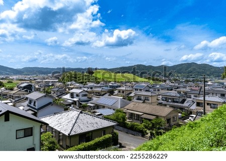 small hill which is ancient tomb is located in a local residential area in Saga prefecture, Japan. Royalty-Free Stock Photo #2255286229