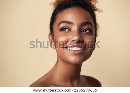 Beauty portrait of African American girl . Beautiful black woman touch her face . Facial  treatment . Cosmetology , skin care  and spa .  Royalty-Free Stock Photo #2255299655