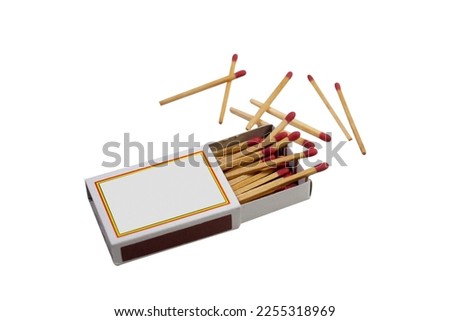 Wooden matches in a matchbox isolated on a white background.