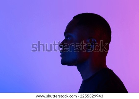 Silhouette head of sad african american man on colourful neon isolated background with copy space Royalty-Free Stock Photo #2255329943