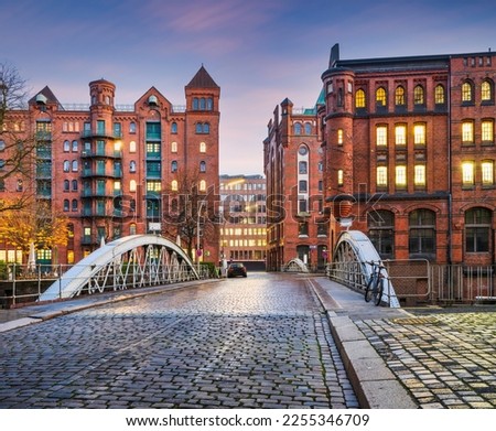Historic Red Brick Buildings and cobblestone Holländischer Brook Fleet bridge in Hamburg, Germany Royalty-Free Stock Photo #2255346709