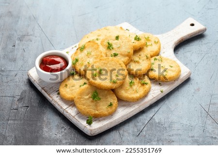 Healthy Cauliflower hash browns on white wooden board Royalty-Free Stock Photo #2255351769