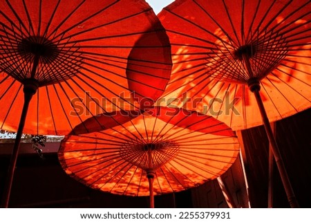 Red chinese umbrellas down view