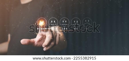 Business people press the smiley face emoticon on the virtual reality touch screen, Customer service evaluation concept. Review and put a check mark. That the score is very impressive. Royalty-Free Stock Photo #2255382915
