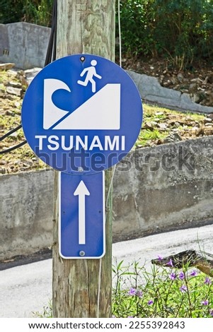 A sign indicates the tsunami evacuation route at Soper's Hole, British Virgin Islands.